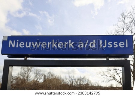 Name sign Nieuwerkerk ad IJssel at the railroad station in this village in the Netherlands