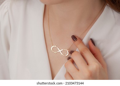 Name silver necklace on attractive female model. Woman wearing personalized necklace. Jewelry photo for e commerce, online sale, social media. - Shutterstock ID 2103473144