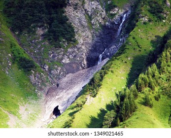 Nameless waterfalls under the Alpine peaks Glarner Vorab and Bünder Vorab in the valley of Im Loch - Canton of Glarus, Switzerland