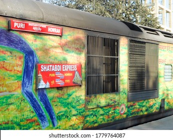 Nameplate On The Coach Of Puri Howrah Shatabdi Express Of East Coast Indian Railway Zone. Duronto Express Yellow Green Color. Howrah India May 2019