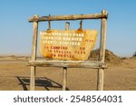 Namib Naukluft Natural Park; Sandwich Harbour entry sign in Walvis Bay; Namibia; Africa