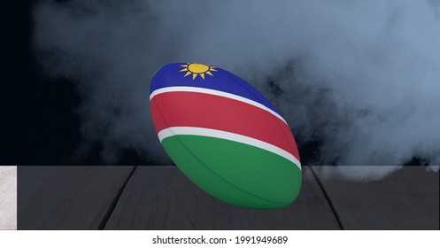 Namibia flag on rugby ball over wooden surface against smoke effect on black background. sports tournament and competition concept - Powered by Shutterstock