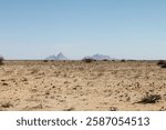 Namibia - March 15, 2018: Panormaic view of Spitzkoppe mountain with surrounding plains as seen from a distance.