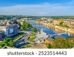 Namur cityscape with confluence of Sambre and Meuse rivers with bridges, aerial panoramic view of Namur city, skyline horizon with green forests trees on hills, Wallonia, Walloon Region, Belgium