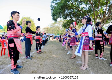 Nan, Thailand, Dec 30, 2019 - Hmong people in their traditional costumes who throwing ball as a part of Hmong cultures on Hmong new year festival cerebration day