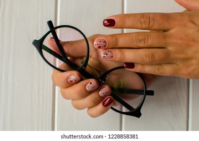 Nanicure Burgundy Color. Nails Design. Nails With Hearts. Top View. Place For Text. St. Valentines Nails Concept.