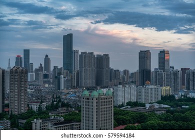 NANJING, CHINA - MAY 2016 - Nanjing Cityscape Sunset, Big Towers Vs Small Old House Buildings.