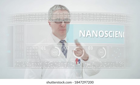 NANOSCIENCE Text On A Modern Touchscreen Display And A Male Scientist Wearing White Lab Coat