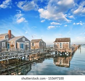 Nantucket, MA. Beautiful Port view with Wooden Homes at sunset.