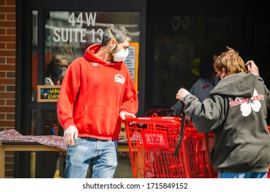 Naperville, IL - 4/16/20: Grocery Store Worker Wearing N95 Mask And Gloves To Protect From Contracting Covid 19 While Working During The Global Coronavirus Pandemic