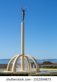 Napier, Hawkes Bay, New Zealand - Feb 7 2015: Spirit Of Napier Known As Gilray Fountain Is The Iconic Napier's Statue Symbolizes City Rising From The Ashes After The 1931 Earthquake. Space For Text.