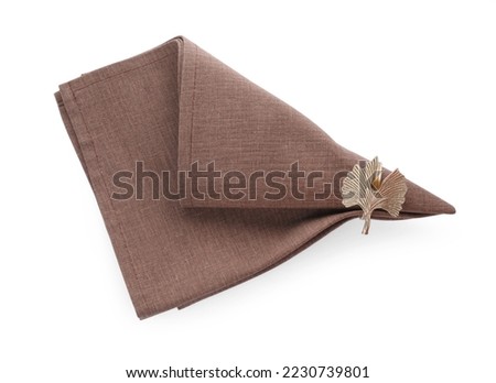 Napkin with decorative ring for table setting isolated on white, top view