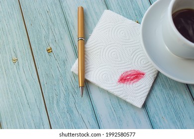 Napkin with a handle and a cup of coffee on a light wooden table, with a place for your text - Powered by Shutterstock