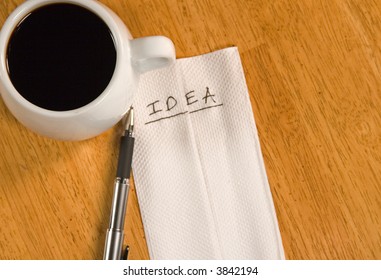 A Napkin Idea With Coffee Cup And A Pen