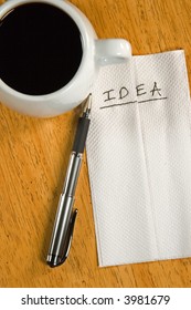 A Napkin Idea With Coffee Cup And A Pen