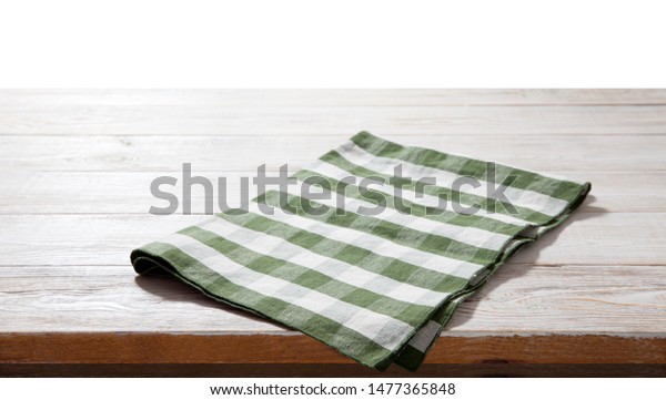 Napkin. Kitchen towel or table\
cloth on white wooden scene. Mock up for design. Top view\
mockup.