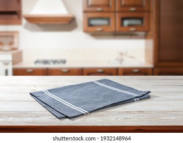 Napkin on wooden desk perspective. Kitchen background selective focus.