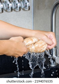 The Napkin Is Squeezed Out Of Excess Water