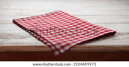 Napkin. Tablecloth tartan, checkered, dish towels on white wooden table background top view closeup