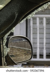 NAPLATE, IL/USA - MARCH 3, 2017: A Side Mirror On A Car Is Partly Framed By Remnants Of A Windshield Shattered By An EF-3 (enhanced Fujita Scale) Tornado That Blasted This Small Town On February 28.