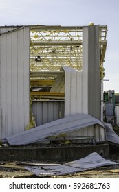 NAPLATE, IL/USA - MARCH 3, 2017: A Roof Is Missing From This Corner Of A Large Glass Factory Smashed By An EF-3 (enhanced Fujita Scale) Tornado That Blasted This Small Town On February 28.