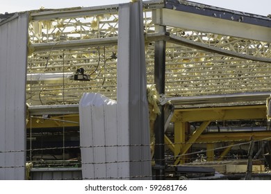 NAPLATE, IL/USA - MARCH 3, 2017: A Roof Is Missing From This Corner Of A Large Glass Factory Smashed By An EF-3 (enhanced Fujita Scale) Tornado That Blasted This Small Town On February 28.