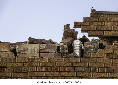 NAPLATE, IL/USA - MARCH 3, 2017: Part Of A Smashed Brick Wall Of A House Missing Its Roof After EF-3 (enhanced Fujita Scale) Tornado That Wreaked Havoc Across This Small Town On February 28.