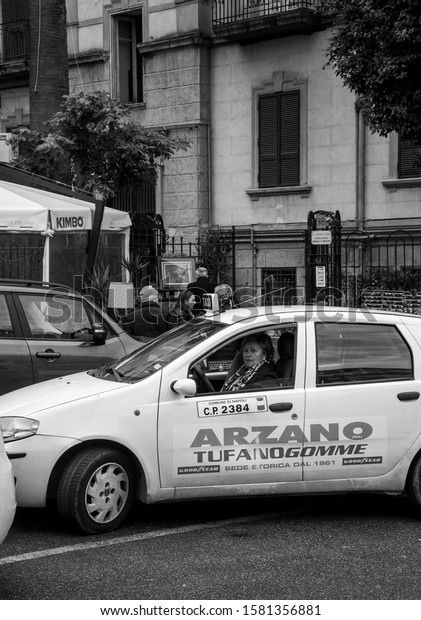 Naples 12/07/2019 old lady photographed while she\
is driving a taxi.