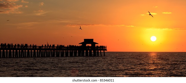 Naples Fishing Pier At Sunset In Florida.