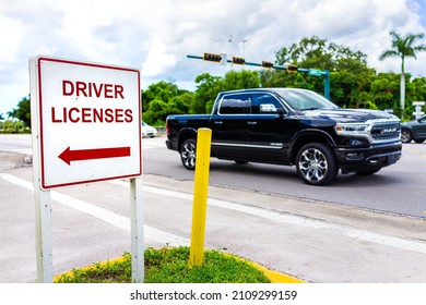 Naples, Florida - August 9, 2021: Downtown Street Road With Car And Roadside Sign Signpost For Directions To Driver License Office For Renewal