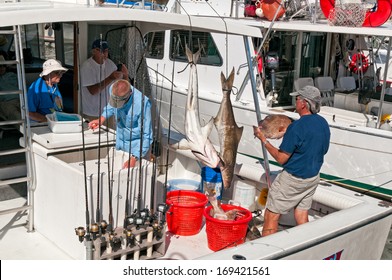 NAPLES, FLORIDA - OCTOBER 26, 2010: Group Of Recreational Fishermen On A Boat Returning From A Deep Sea Fishing Trip