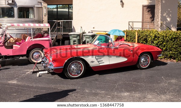 Naples, Florida, USA – March 23,2019: Red\
1961 Chevrolet Corvette at the 32nd Annual Naples Depot Classic Car\
Show in Naples, Florida. Editorial\
only.