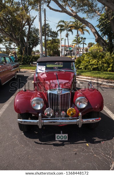 Naples, Florida, USA – March 23,2019: Red 1954 MG\
TF at the 32nd Annual Naples Depot Classic Car Show in Naples,\
Florida. Editorial\
only.