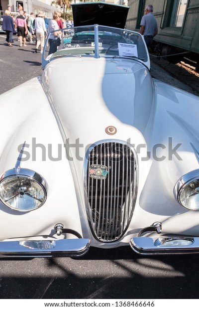Naples, Florida, USA – March\
23,2019: White 1961 Jaguar XK150 Convertible S at the 32nd Annual\
Naples Depot Classic Car Show in Naples, Florida. Editorial\
only.