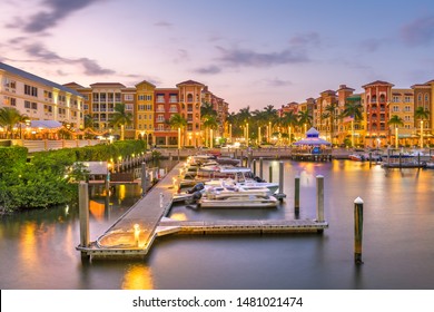 Naples, Florida, USA town skyline on the water at dusk.