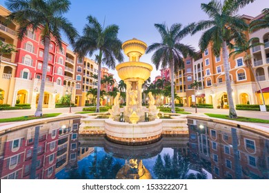 Naples, Florida, USA Town Skyline And City Plaza At Twilight.