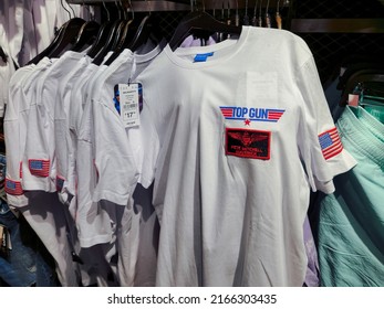 Naples, Italy - June 03 2022: Top Gun Maverick Movie T-shirt Clothing With Logo At Interior Showcase Of Alcott Stores.