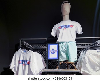 Naples, Italy - June 03 2022: Top Gun Maverick Movie T-shirt Clothing With Logo At Interior Showcase Of Alcott Stores.