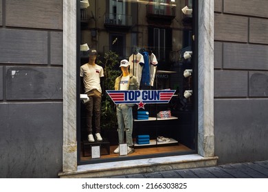 Naples, Italy - June 03 2022: Top Gun Maverick Movie T-shirt Clothing With Logo At Exterior Window Showcase Of Alcott Stores.