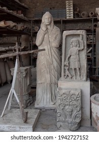 NAPLES, ITALY- JUNE, 13, 2019: Statue, Stone Carving And Artifacts Discovered At The Ruin St The Ancient Roman City Of Pompeii