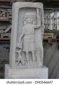 NAPLES, ITALY- JUNE, 13, 2019: A Stone Carving Of A Child And Yheir Pet Dog At Pompeii Ruins