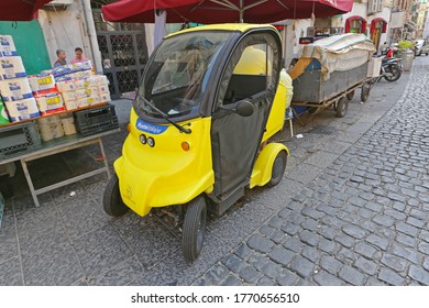 Naples, Italy - June 23, 2014: Poste Italiane Small Electric Utility Vehicle In Naples, Italy.