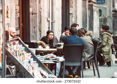 NAPLES, ITALY - MARCH 20, 2015: People Eating At Small Cafe In Naples, Italy