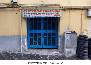 Naples, Italy, October 2021: Blue Store Front Car Mechanic Shop In Naples, Italy.