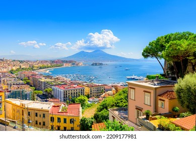 Naples, Italy. View of the Gulf of Naples from the Posillipo hill with Mount Vesuvius far in the background and some pine trees in foreground. August 31, 2021.  - Shutterstock ID 2209177981