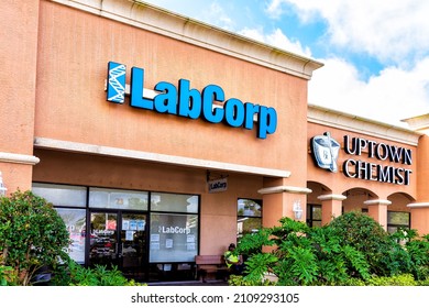 Naples, USA - January 27, 2021: Laboratory Corporation Of America Holdings LabCorp Office In Florida With Blue Sign Text At Entrance To Strip Mall Building And Uptown Chemist Business