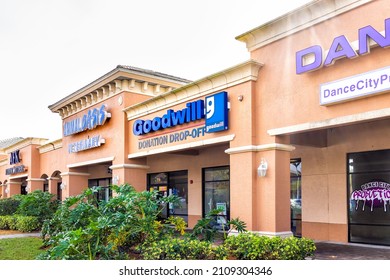 Naples, USA - January 27, 2021: Goodwill Thrift Store Office Business In Florida With Sign For Dance City And Animal Oasis Veterinary At Entrance To Strip Mall Building