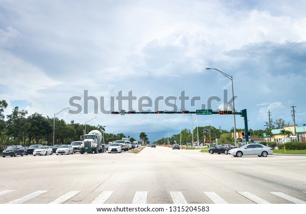 Naples, USA - jun 13, 2018: Road in Naples city by\
the mexican gulf