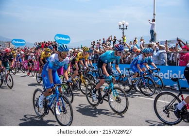 Naples,Italy: May 14, 2022. Cyclist during The Giro d`Italia 105 bicycle race.start from Rotonda Diaz in Naple, with spectators along the sidewalk.