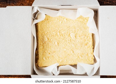 Napoleon Cake In A Cardboard Box. Sweet Gift. Delivery Of Confectionery. Top View.